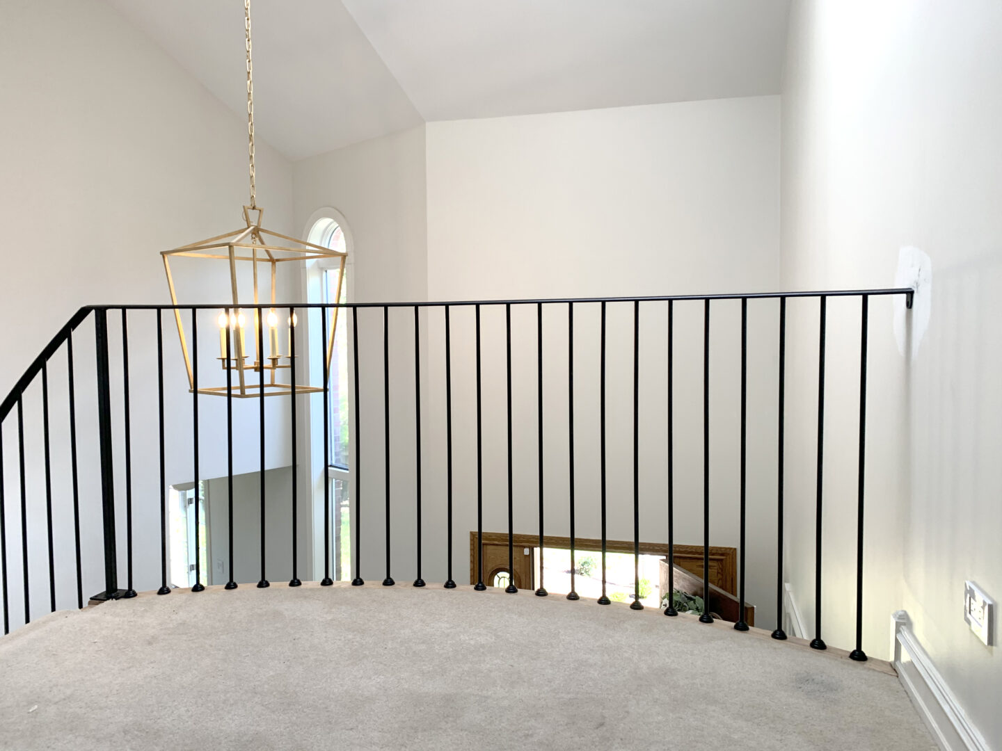 Custom wrought iron railings minimalist painted satin black top guard view