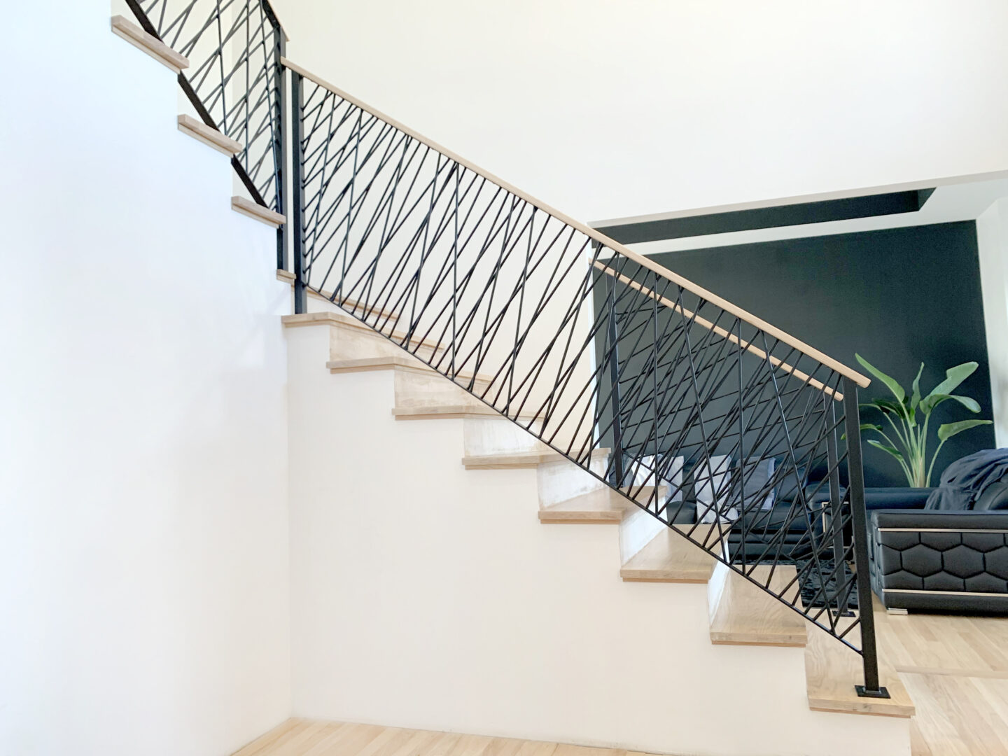 Custom wrought iron & wood railings art deco painted satin black side stairwell view