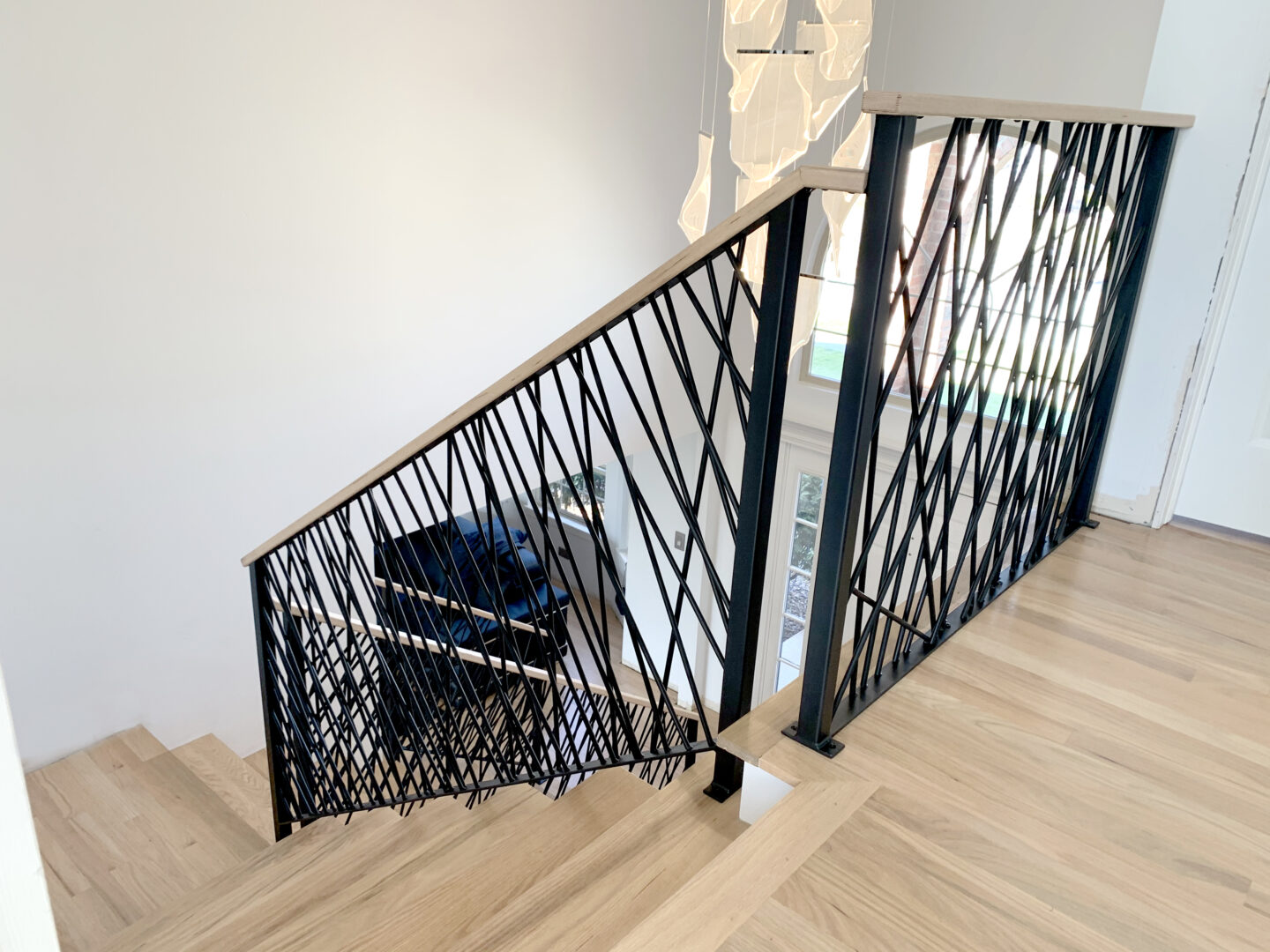 Custom wrought iron & wood railings art deco painted satin black staircase entrance top view