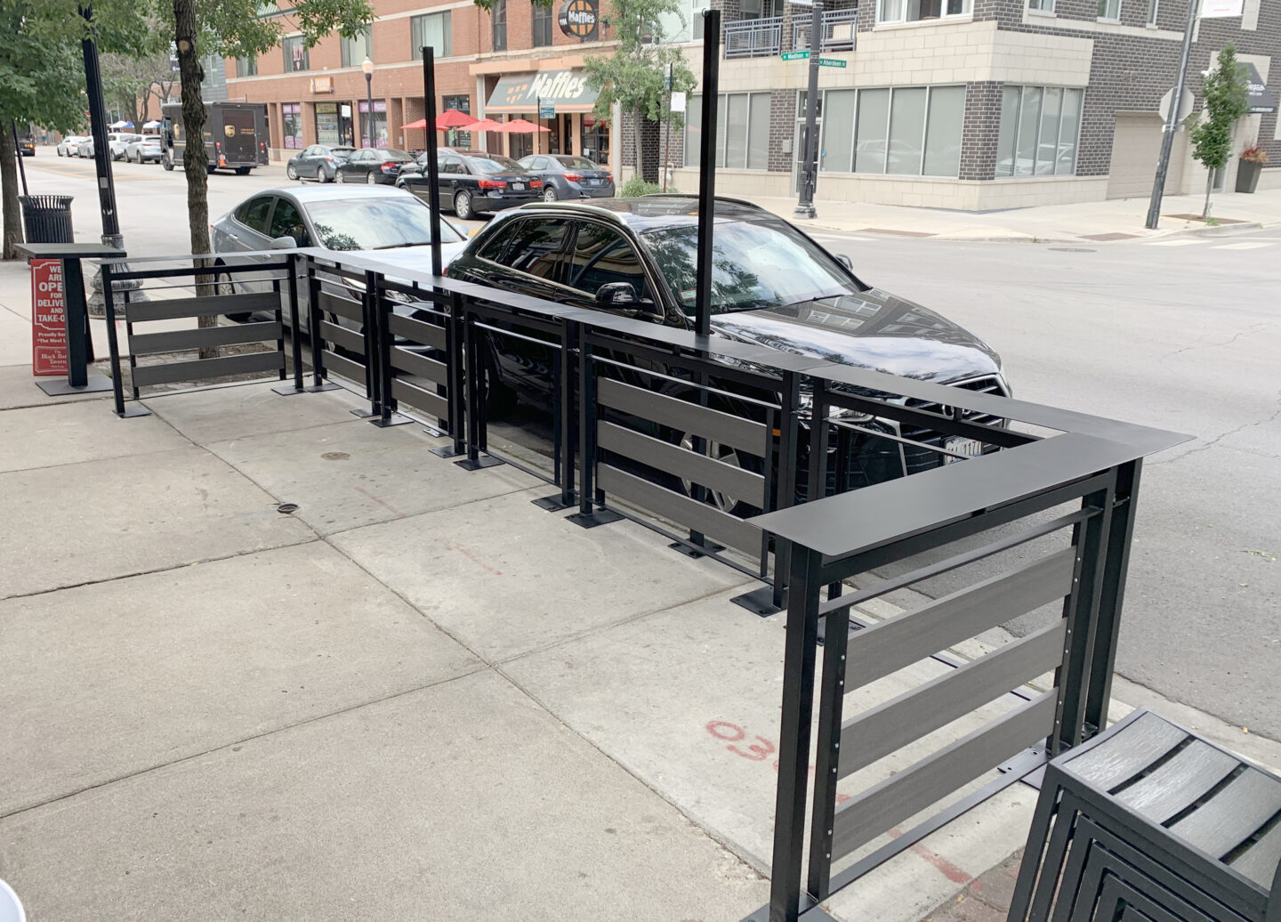 Traditional wrought iron commercial patio railing painted satin black in Chicago side view