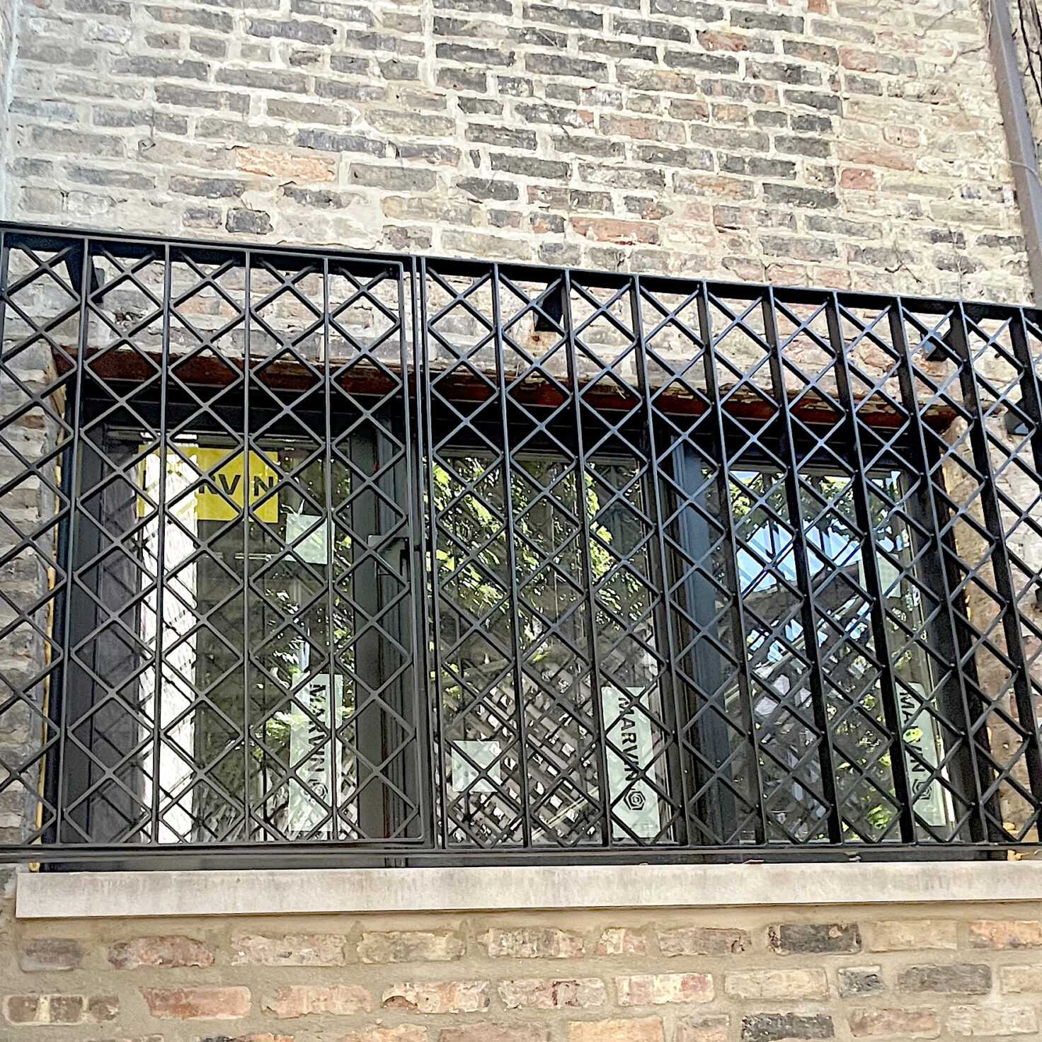 Custom wrought iron window guards for your home & business Signature