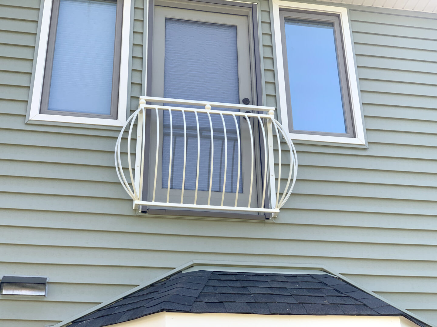 Transitional belly wrought iron balcony painted white alt view