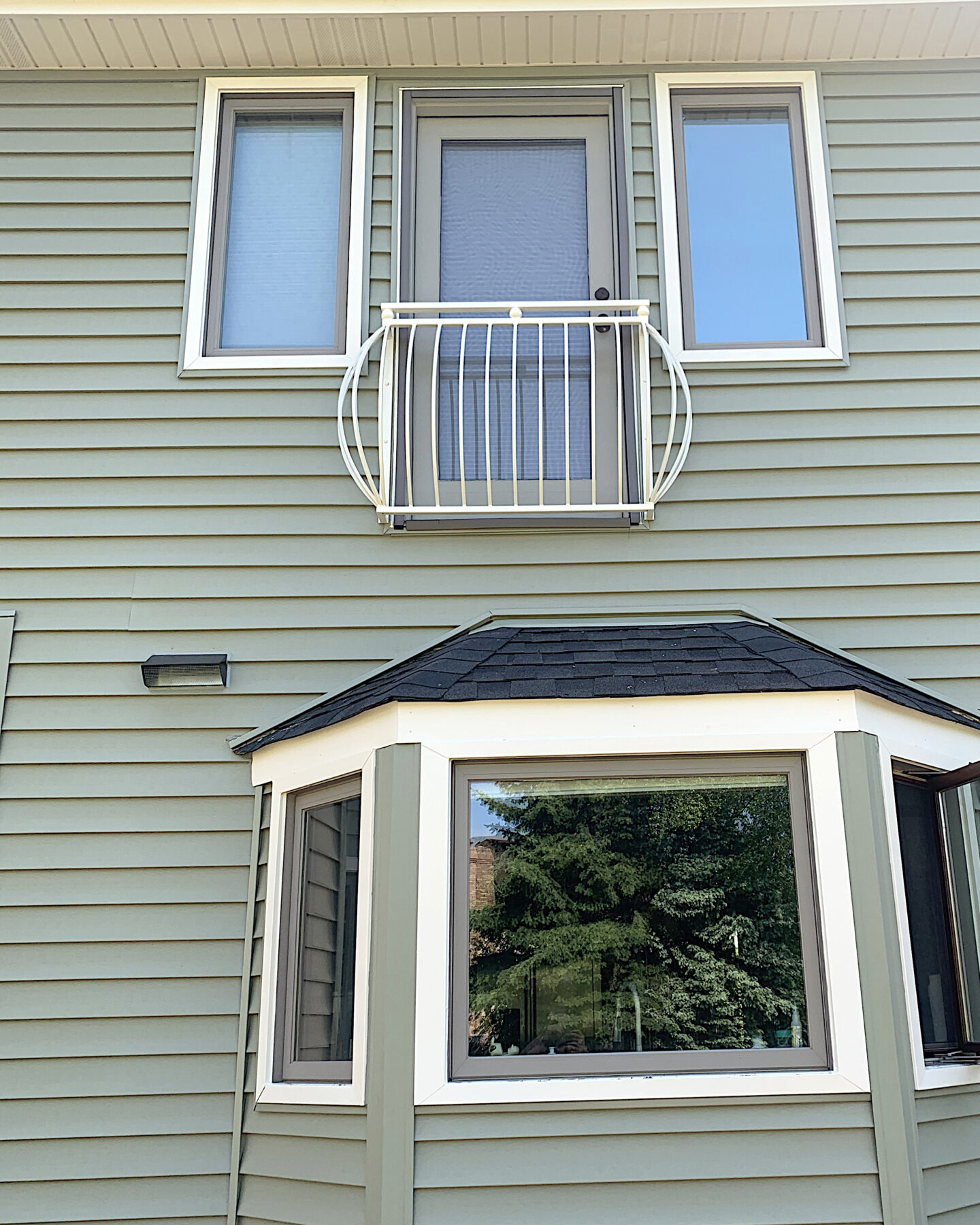 Transitional belly wrought iron balcony white