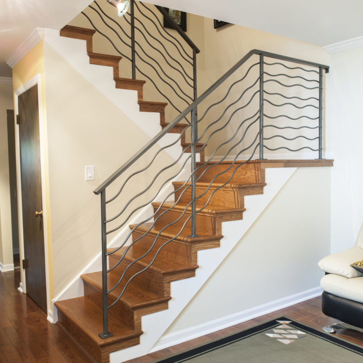 Custom art deco wrought iron wave railings painted graphite for a client in Deerfield