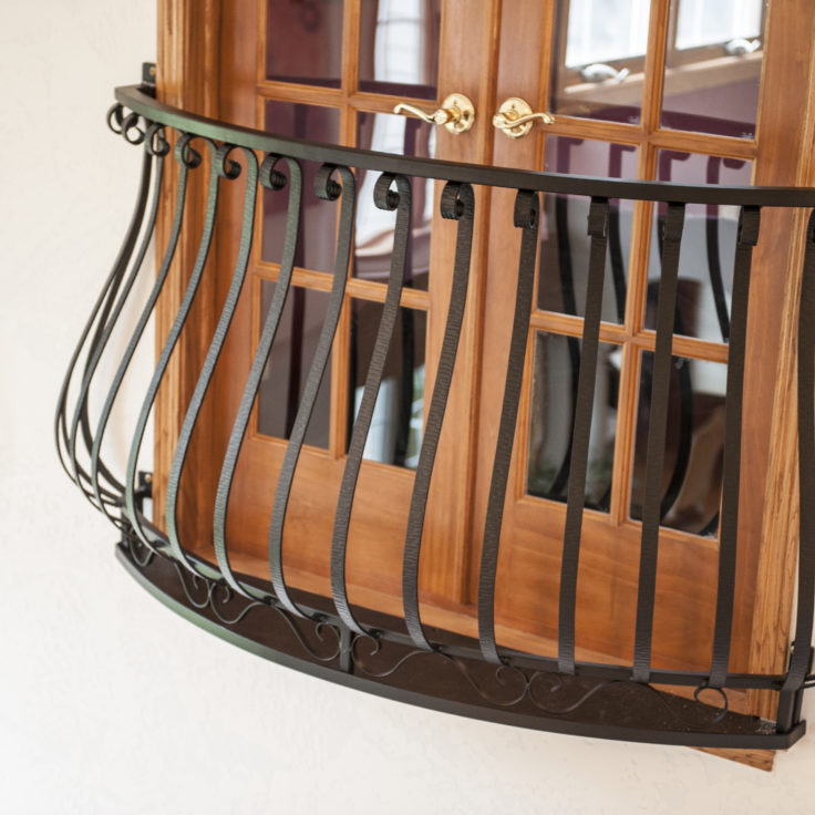Custom french country wrought iron belly balcony painted satin black for a client in Barrington