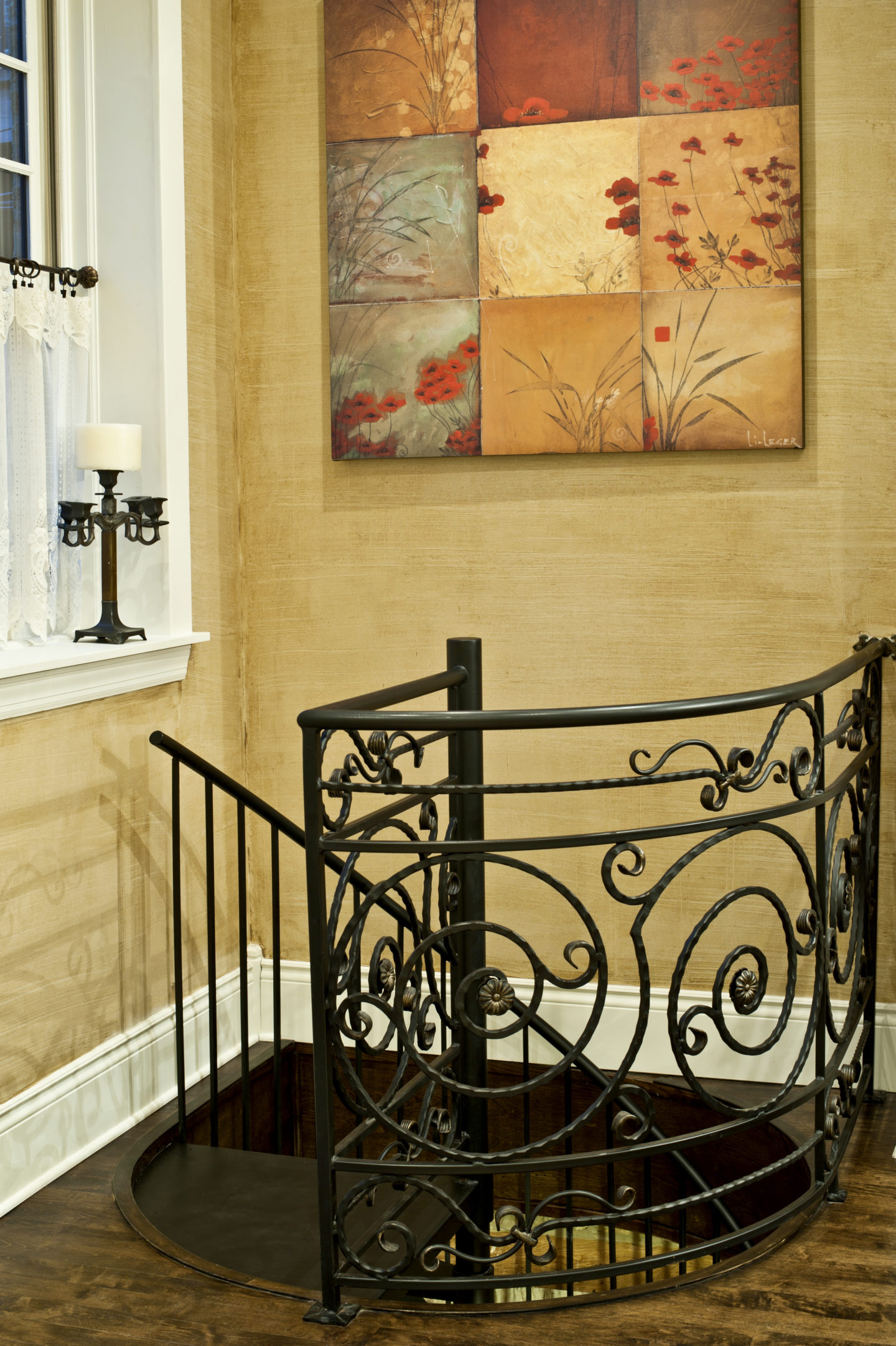 Custom french country wrought iron scroll railings painted gold patina-over-black for a client in Lincoln Park