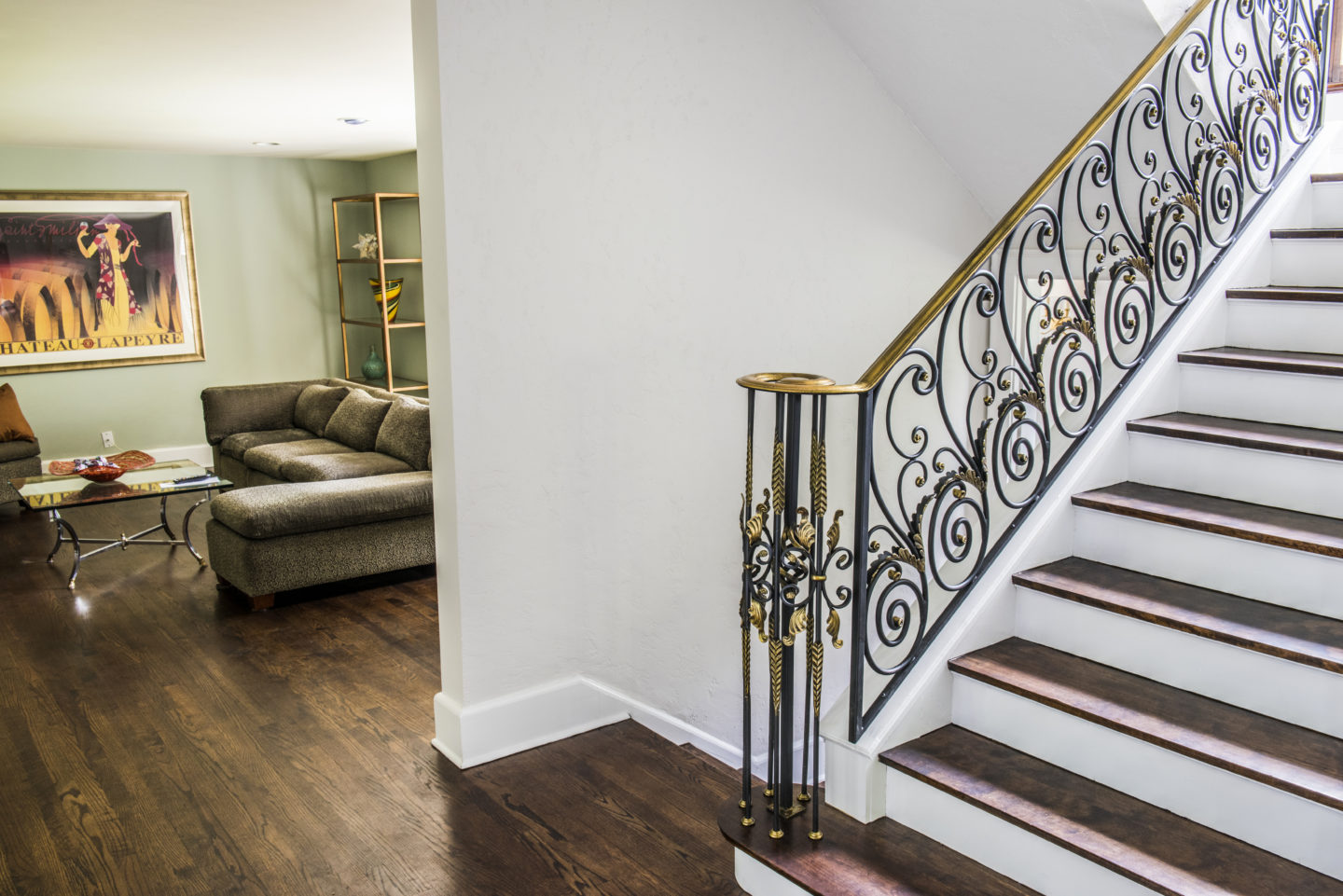 Custom french country wrought iron scroll railings painted gold patina-over-black for a client in Winnetka