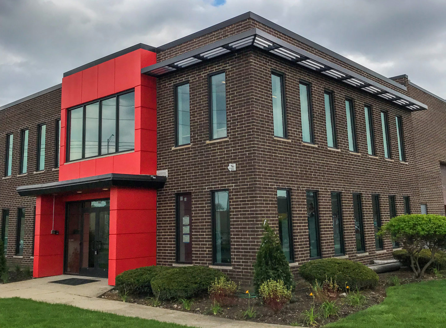 Custom industrial aluminum shade awning powder coated gray for a client in Elk Grove-Village