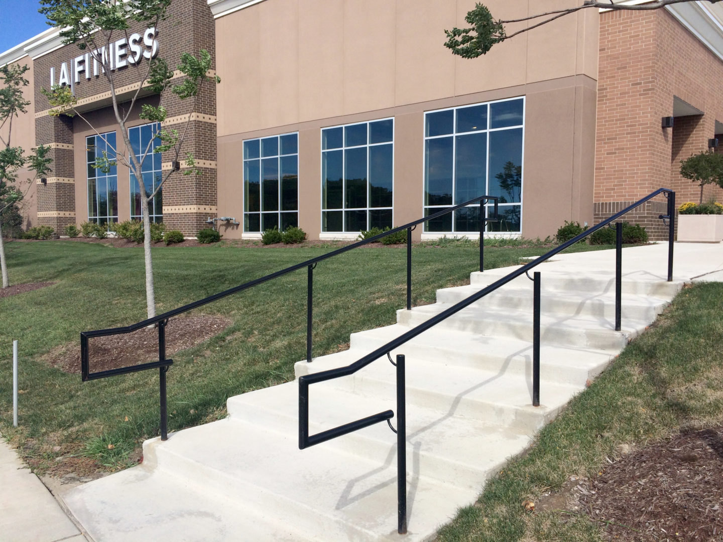 Custom industrial wrought iron ada handrails painted gloss black for a client in Glenview