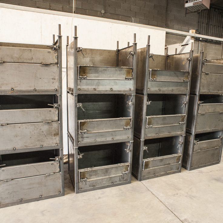 Custom industrial wrought iron manufacturing bins painted clear coat for a client in Elk Grove-Village
