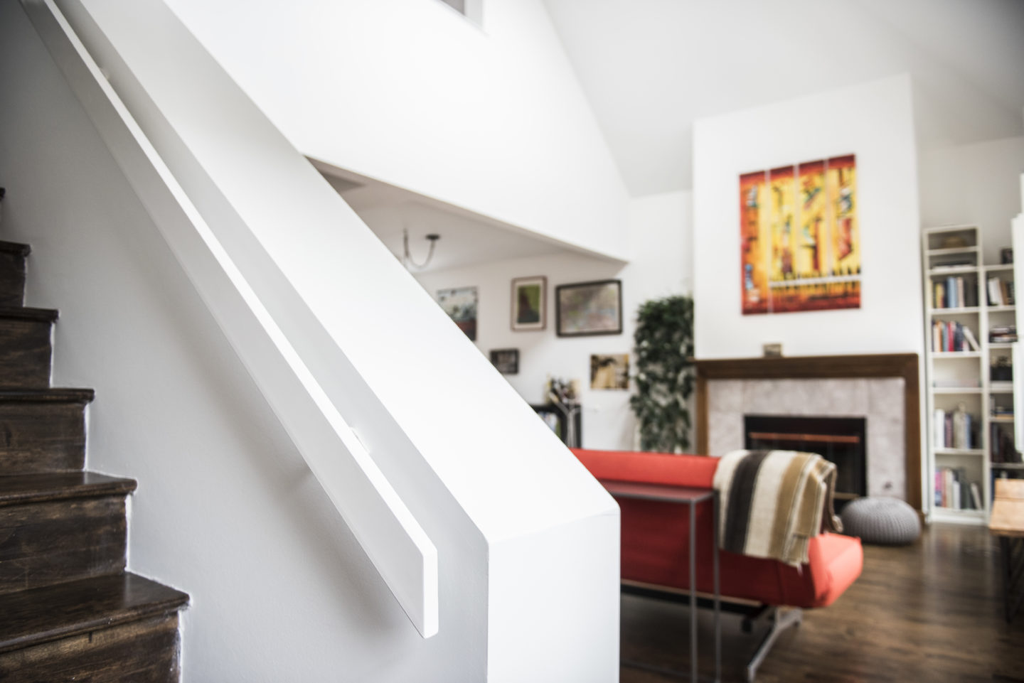 Custom minimalist aluminum flat handrails powder coated white for a client in Bucktown