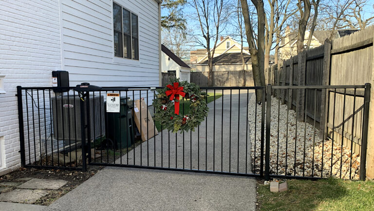 custom residential wrought iron motorized gate closed