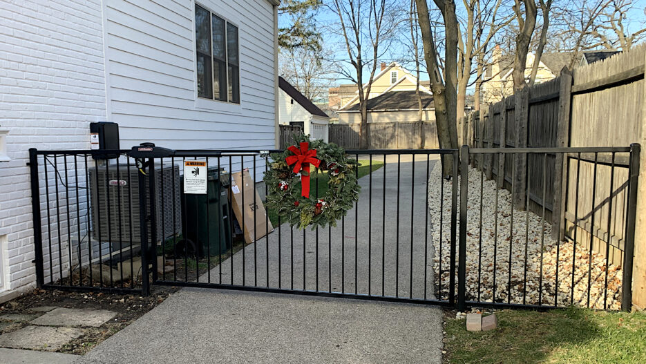 custom residential wrought iron motorized gate closed