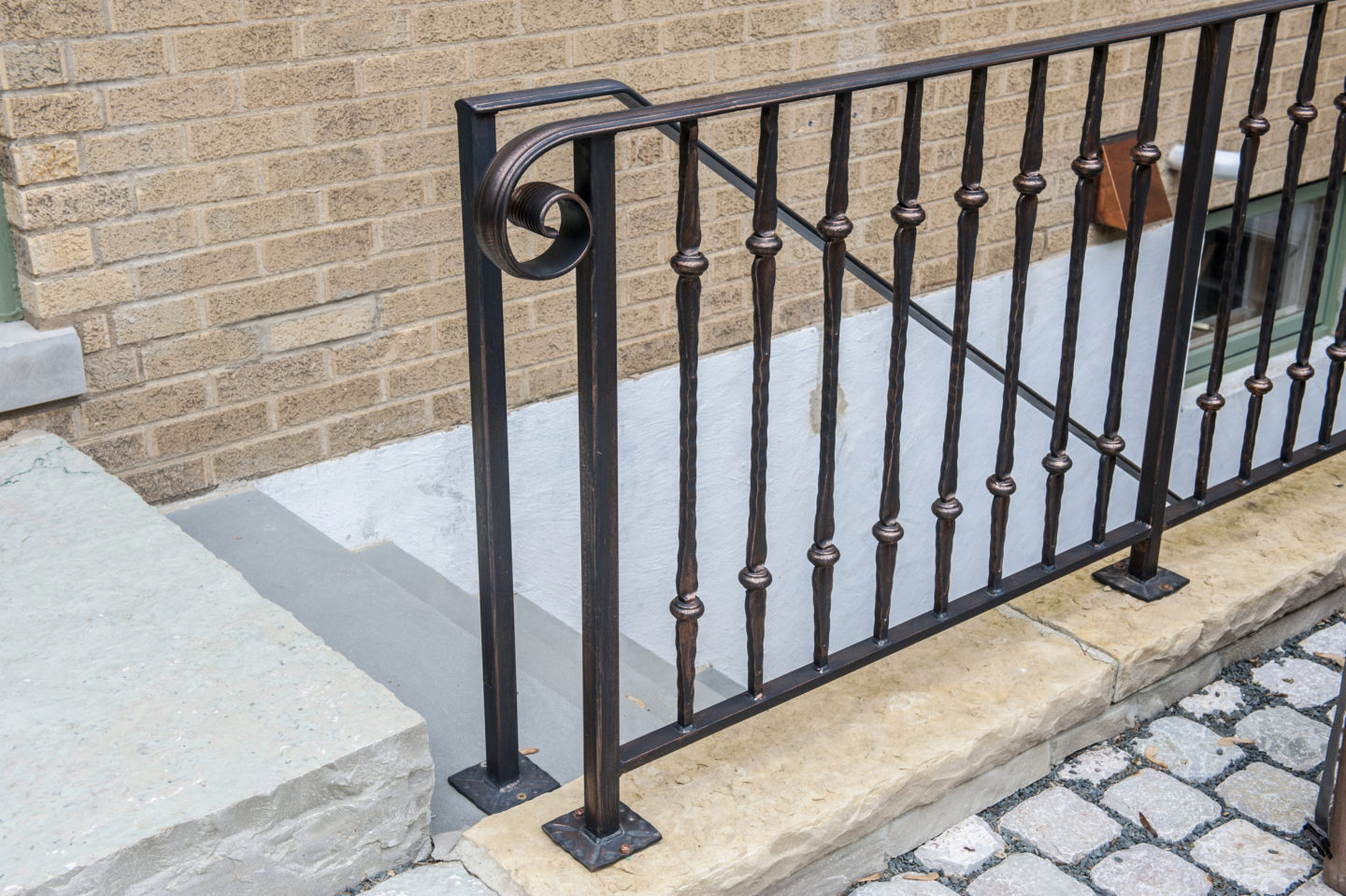 Custom rustic wrought iron collar railings painted copper for a client in Evanston